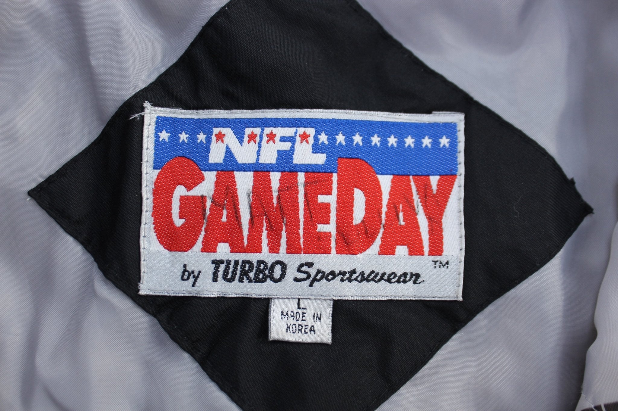 90's Raiders Football Embroidered Puffer Jacket - ThriftedThreads.com