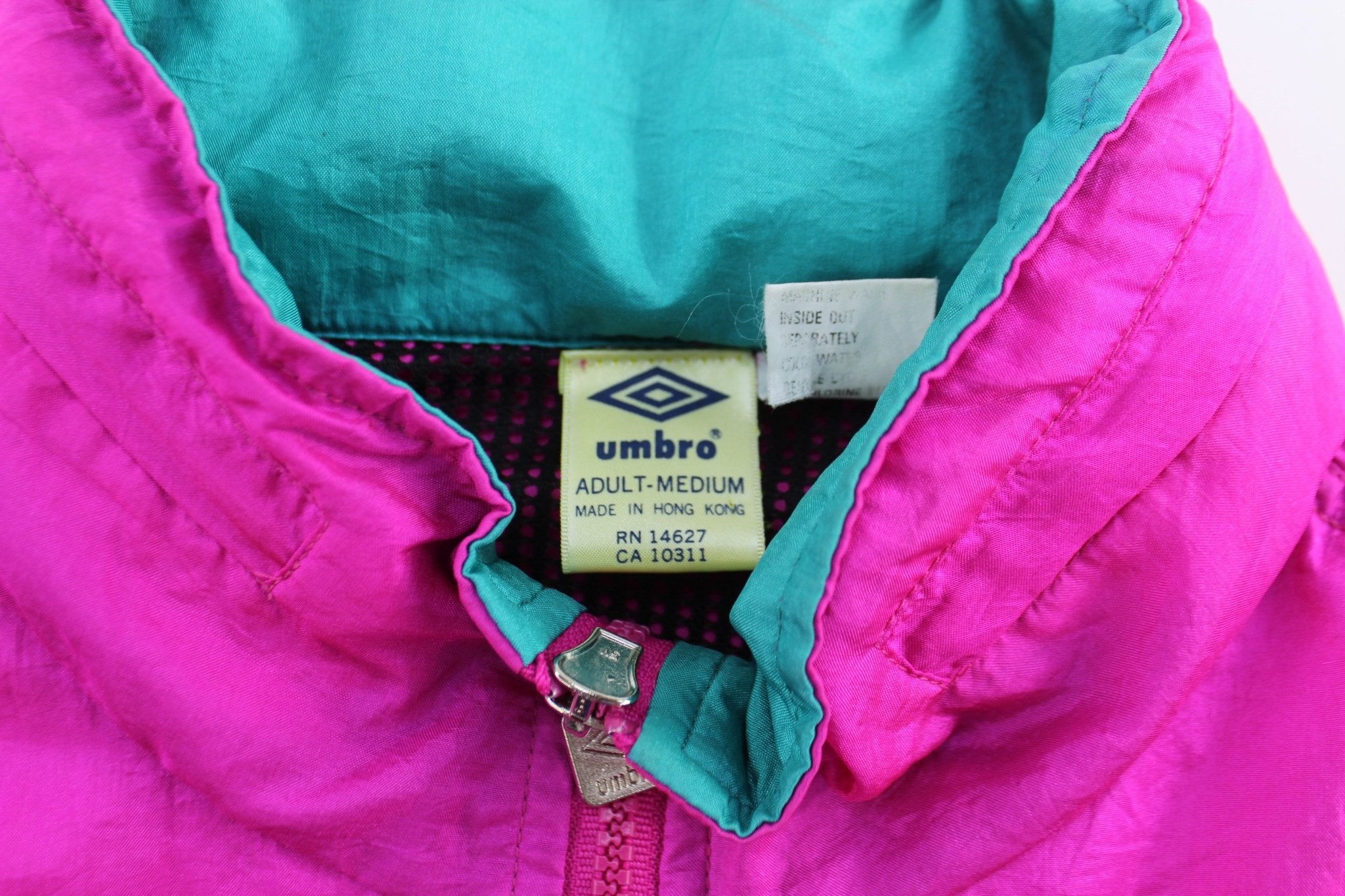 90's Umbro Embroidered Logo Blue & Pink Pullover Jacket - ThriftedThreads.com