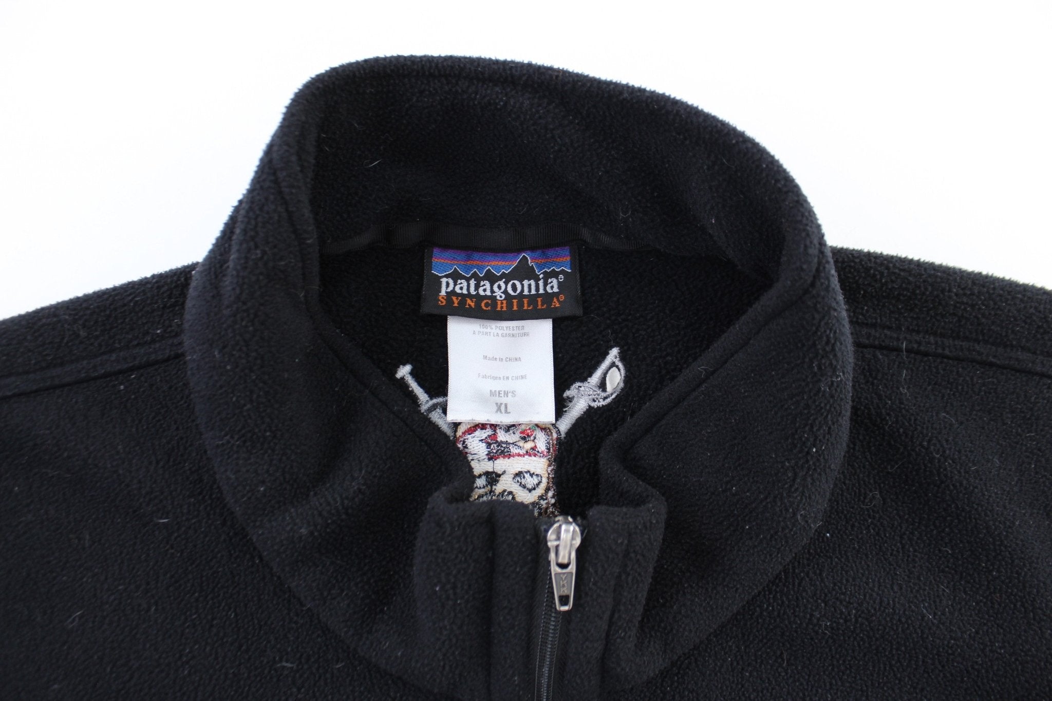 Patagonia Synchilla Embroidered Pirate Logo Black Zip Up Jacket - ThriftedThreads.com