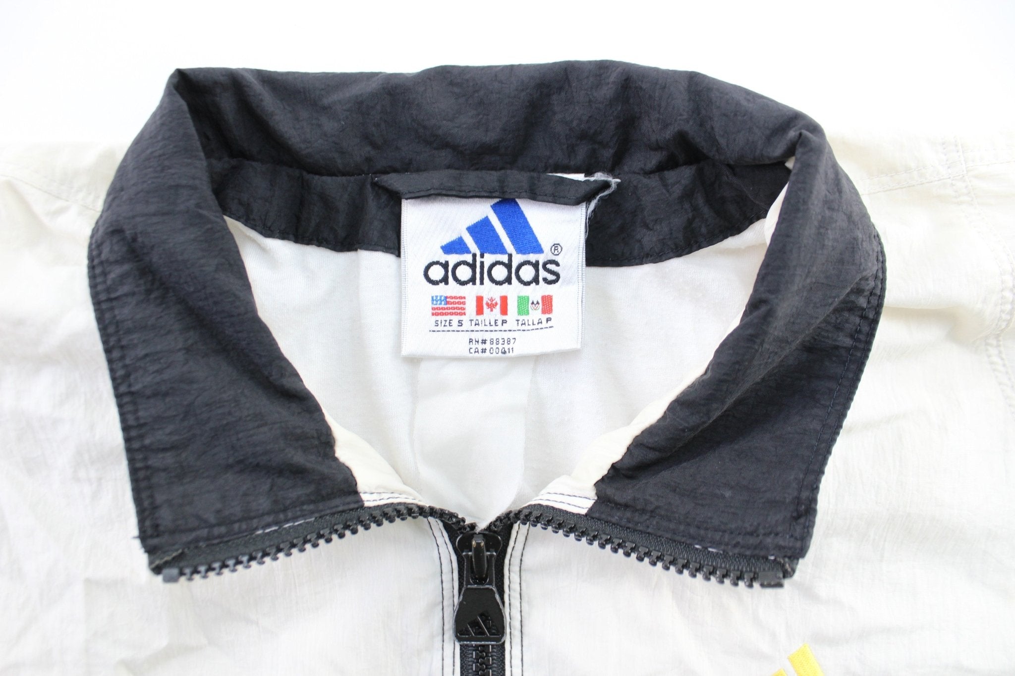 Vintage Adidas Embroidered Logo Black, White, & Yellow Striped Zip Up Jacket - ThriftedThreads.com