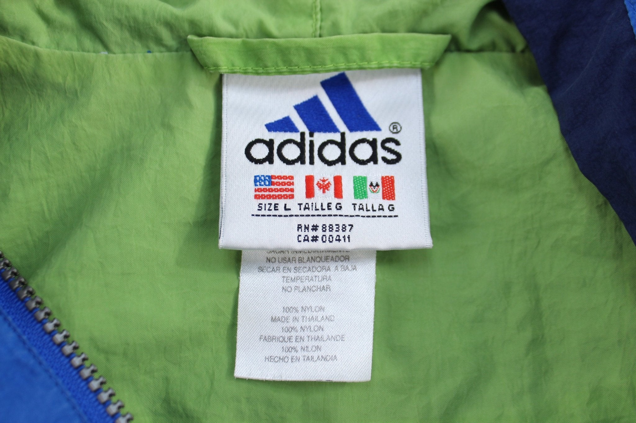 Vintage Adidas Embroidered Logo Blue, Green & White Pullover Jacket - ThriftedThreads.com