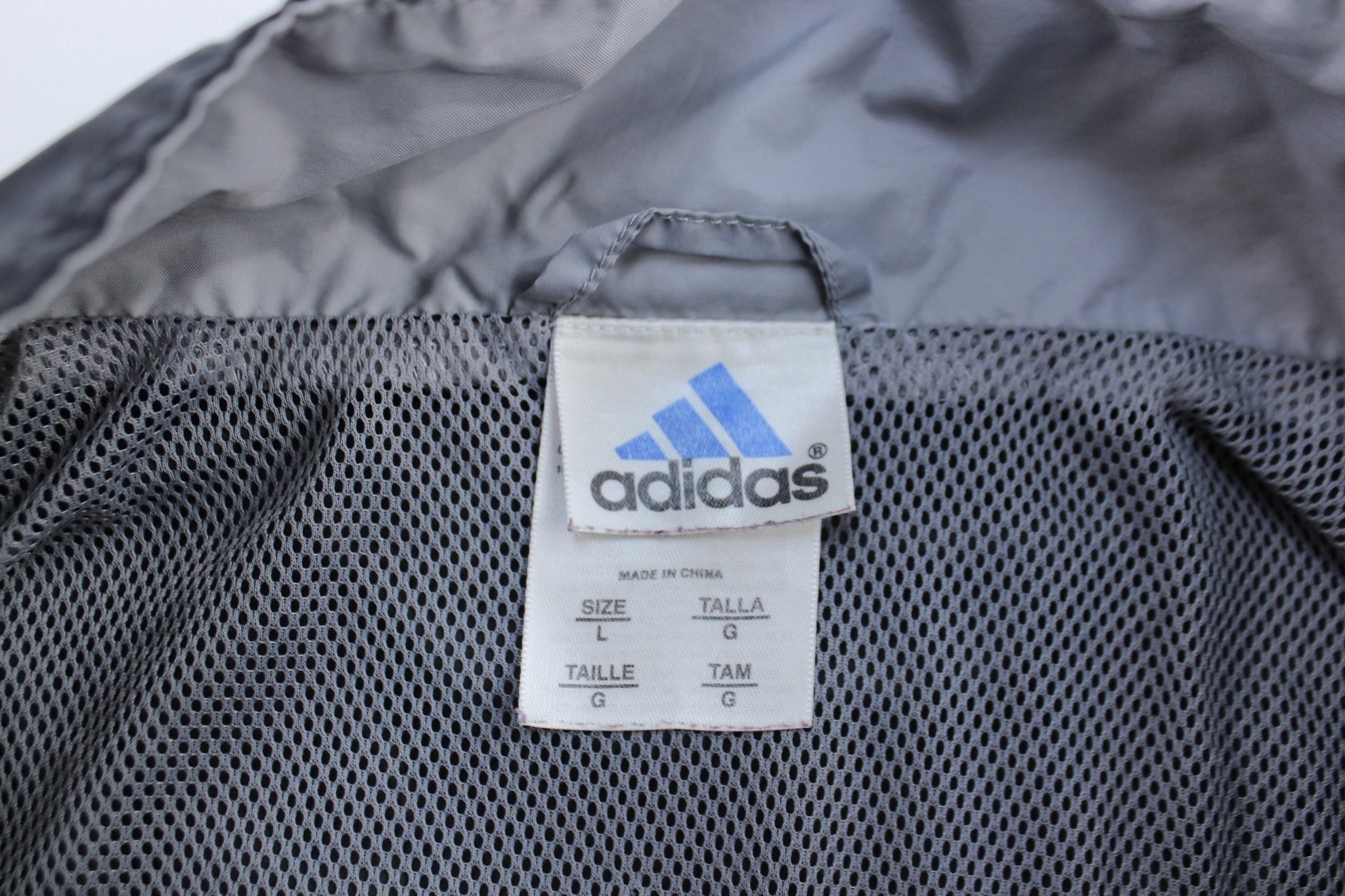 Vintage Adidas Embroidered Logo Grey & Black Striped Zip Up Jacket - ThriftedThreads.com