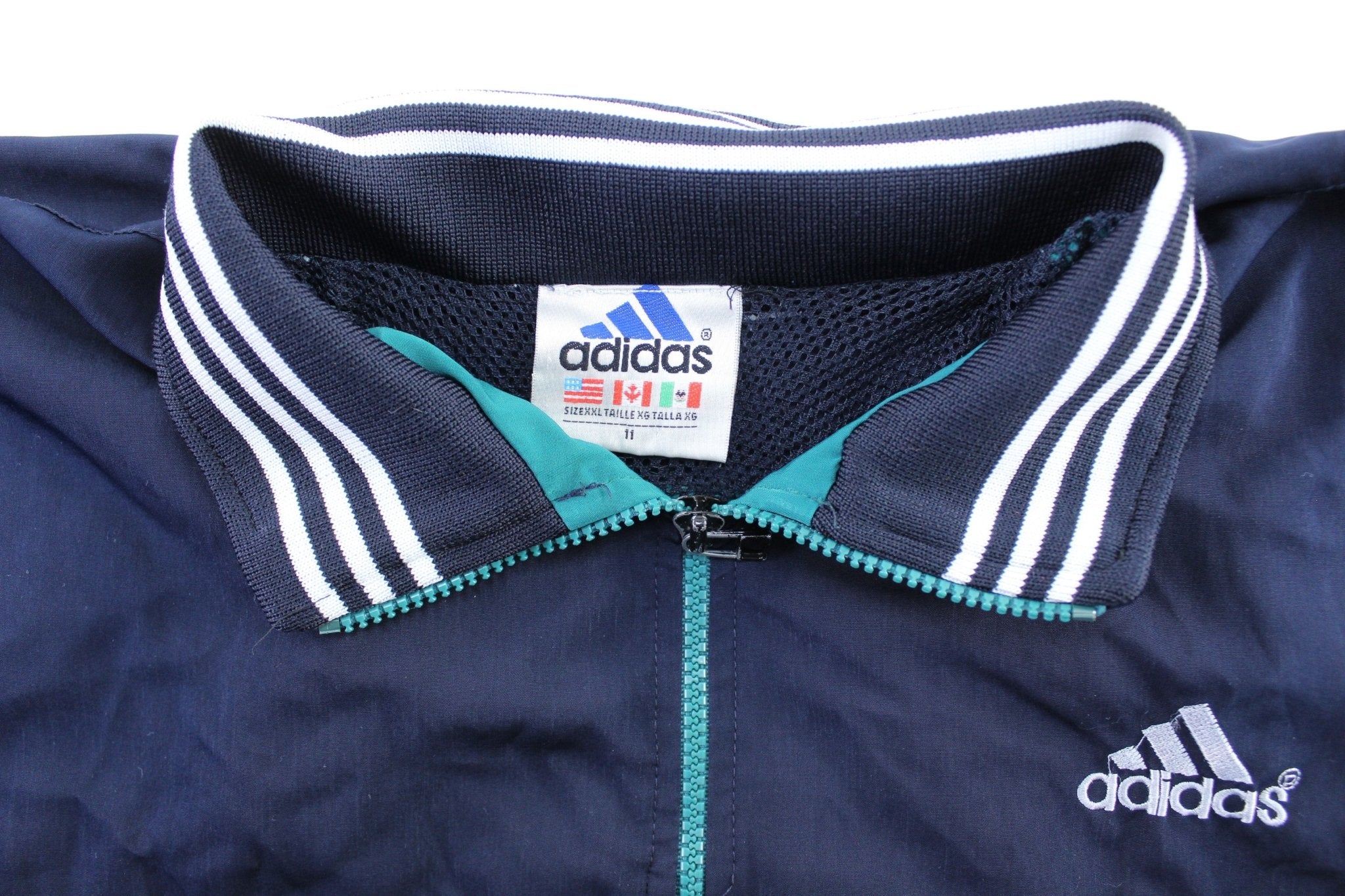 Vintage Adidas Embroidered Logo Navy Blue, Teal, & White Striped Zip Up Jacket - ThriftedThreads.com