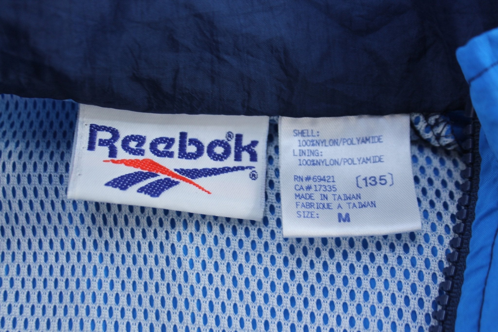 Vintage Reebok Embroidered Logo Blue Abstract Zip Up Jacket - Jackets - Thrifted Threads