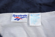 Vintage Reebok Embroidered Logo Blue & White Windbreaker Jacket - ThriftedThreads.com