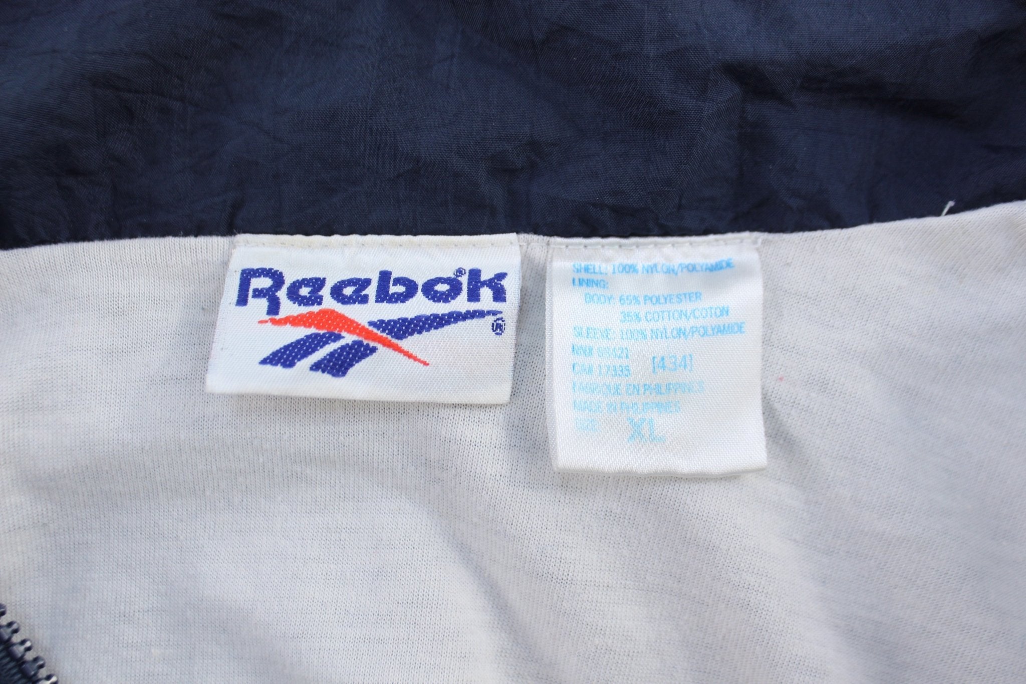 Vintage Reebok Embroidered Logo Blue & White Windbreaker Jacket - ThriftedThreads.com