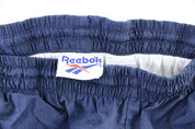 Vintage Reebok Embroidered Logo Navy Blue Windbreaker Pants - ThriftedThreads.com