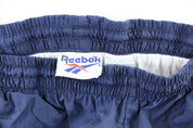 Vintage Reebok Embroidered Logo Navy Blue Windbreaker Pants - ThriftedThreads.com