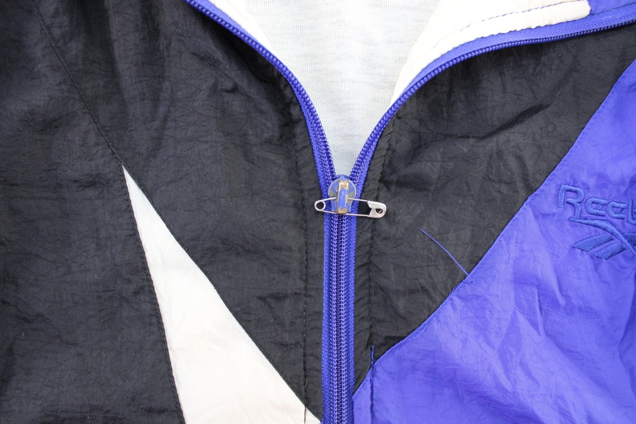 Women's 90's Reebok Embroidered Logo Black, Blue, & White Zip Up Jacket - ThriftedThreads.com