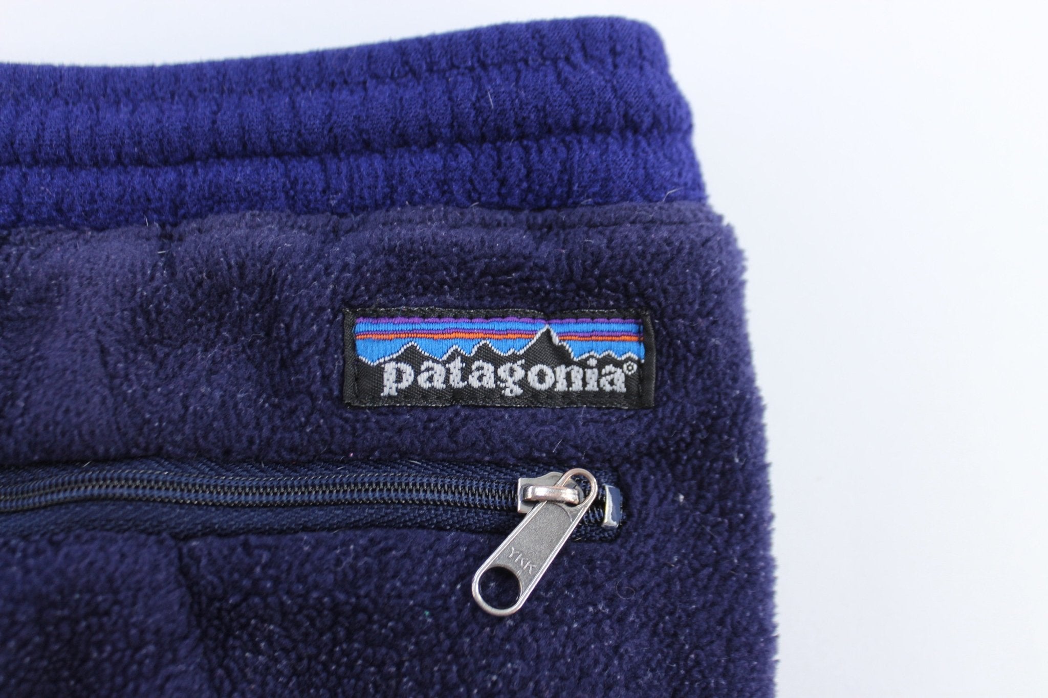 Women's Patagonia Logo Patch Purple Fleece Pants - ThriftedThreads.com