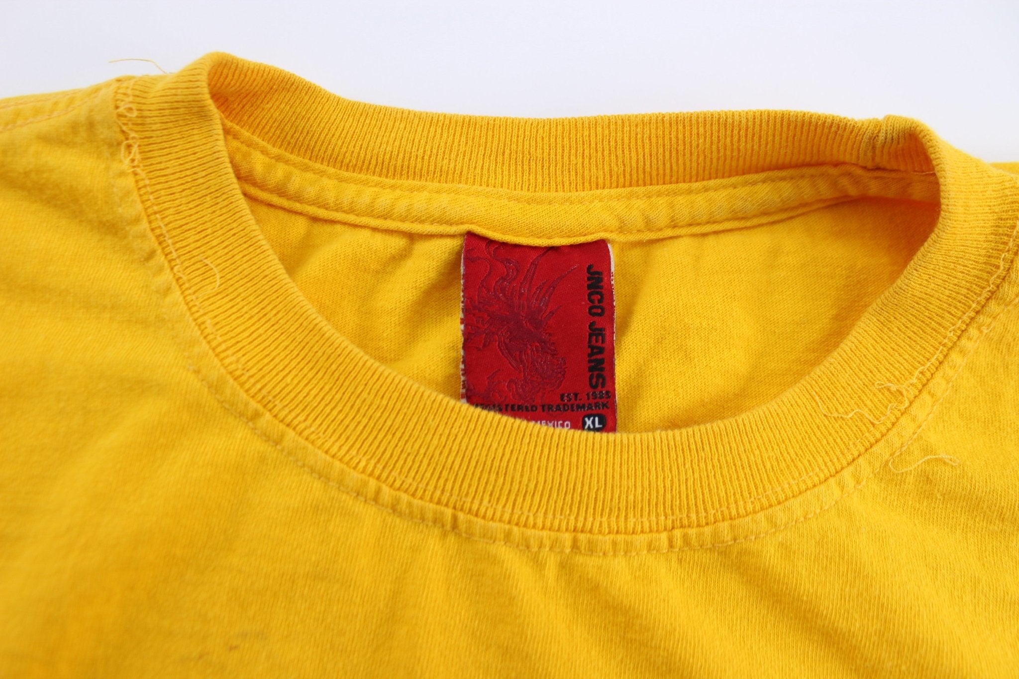 Y2K JNCO Jeans Skull Graphic T-Shirt - ThriftedThreads.com