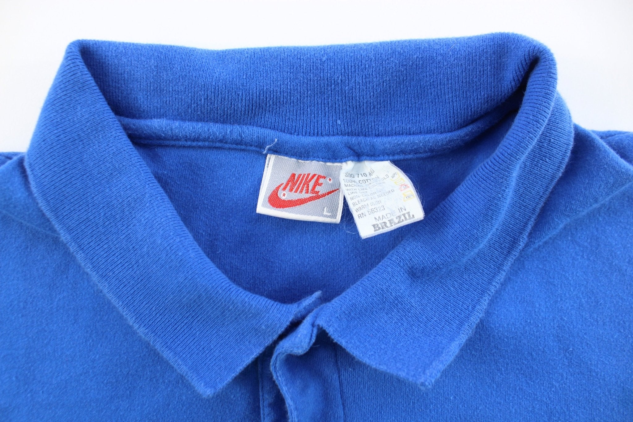 ThriftedThreads Vintage Nike Embroidered Logo Blue Button Up Polo